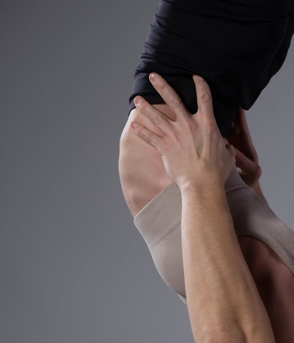 Woman holding a challenging yoga pose with focus and grace.